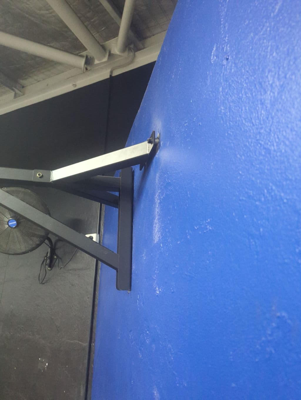 Punching bag bracket pulling away from the wall at the bolts — photo submitted by member via GuardSync at 02:14 AM, 30 May 2026